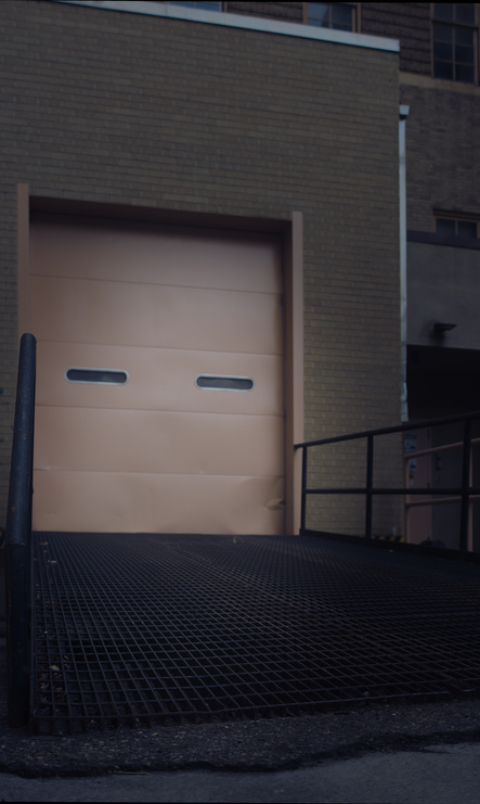 Loading dock with expanded metal mesh ramp