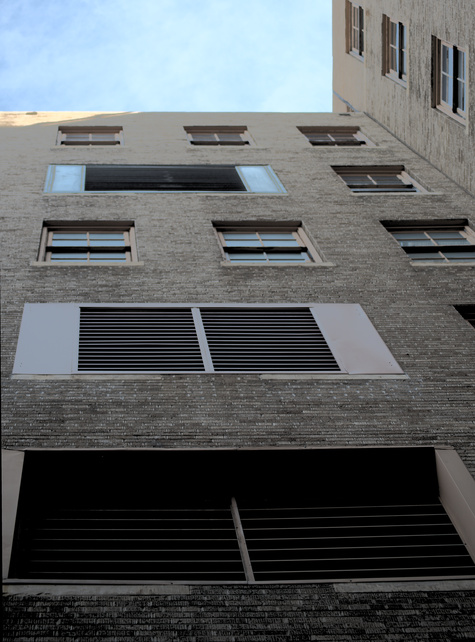 Windows and exhaust vents in 5 story wall